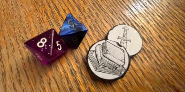 Two 8-sided dice and two tokens (one with a sword and one with tomes)